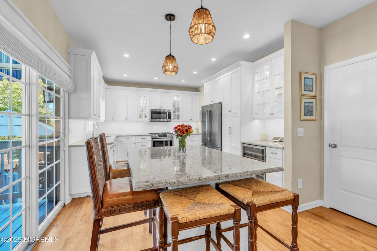 Dining room, Interior, Kitchen, Pendant Lights, Recessed Lighting, Stainless Steel Appliances, Wood Texture Flooring