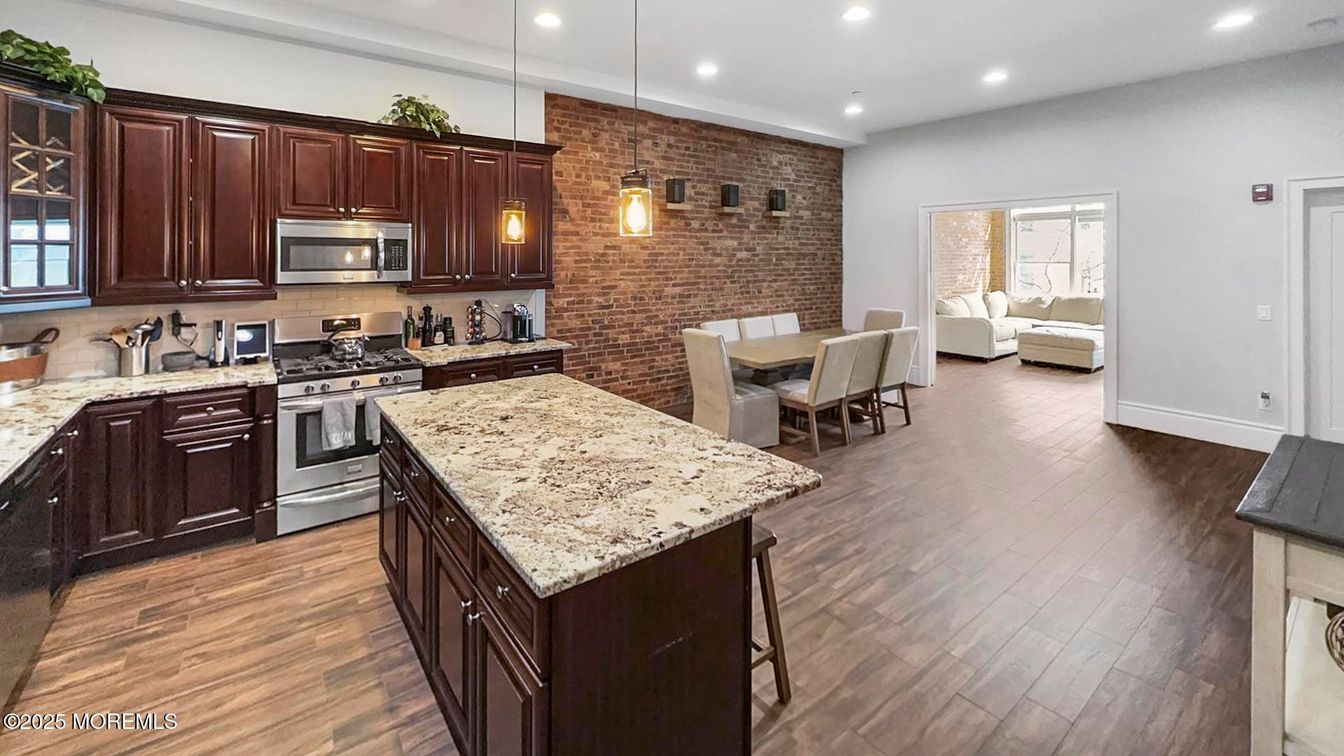Dining room, Interior, Kitchen, Pendant Lights, Recessed Lighting, Stainless Steel Appliances, Stone Walls, Wood Texture Flooring