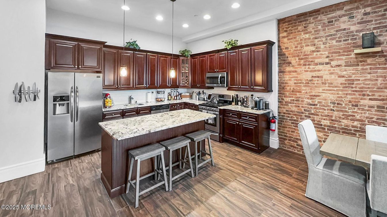 Interior, Kitchen, Pendant Lights, Recessed Lighting, Stainless Steel Appliances, Stone Walls, Wood Texture Flooring