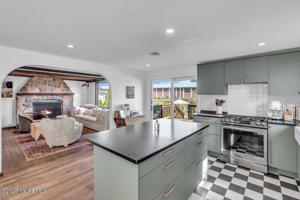 Fireplace, Interior, Kitchen, Living room, Recessed Lighting, Stainless Steel Appliances, Wood Texture Flooring