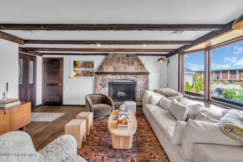 Fireplace, Interior, Living room, Recessed Lighting, Stone Walls, Wood Texture Flooring