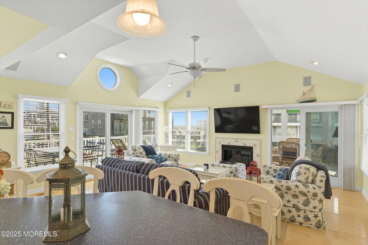 Dining room, Fireplace, Interior, Living room, Recessed Lighting, Wood Texture Flooring