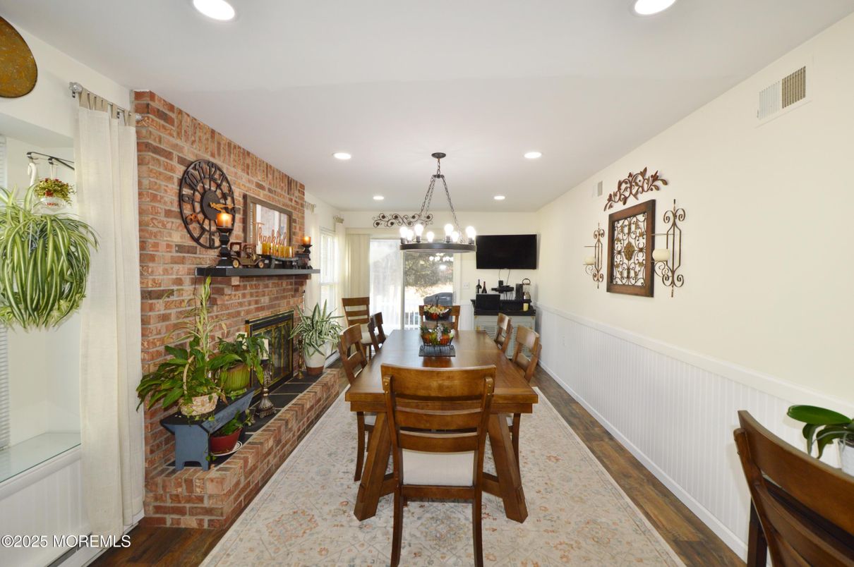 Dining room, Fireplace, Interior, Pendant Lights, Recessed Lighting, Stone Walls, Wood Texture Flooring