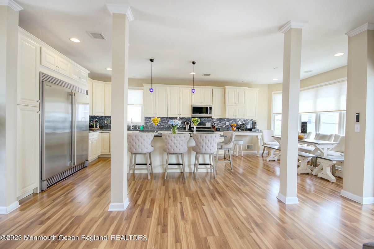 Dining room, Interior, Kitchen, Pendant Lights, Recessed Lighting, Stainless Steel Appliances, Wood Texture Flooring