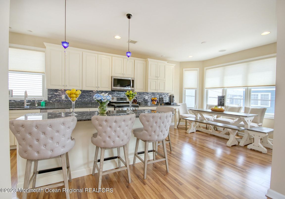 Dining room, Interior, Kitchen, Pendant Lights, Recessed Lighting, Stainless Steel Appliances, Wood Texture Flooring