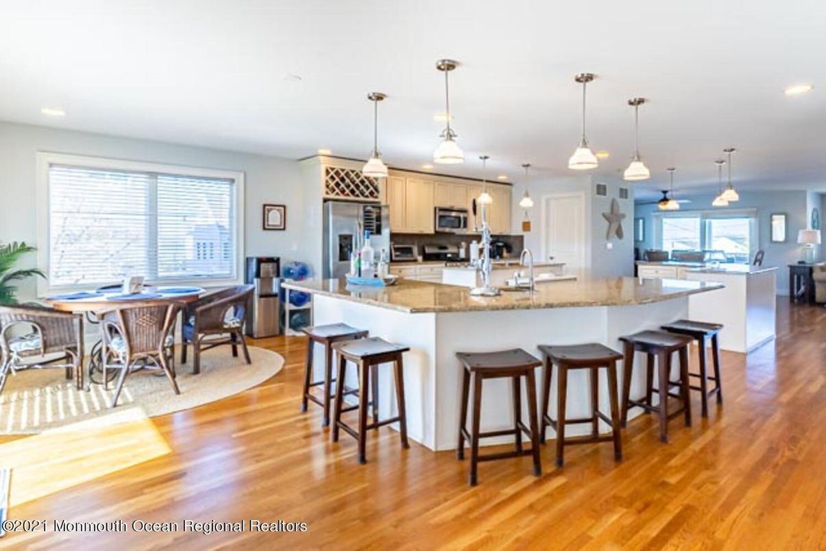 Dining room, Interior, Kitchen, Pendant Lights, Recessed Lighting, Stainless Steel Appliances, Wood Texture Flooring