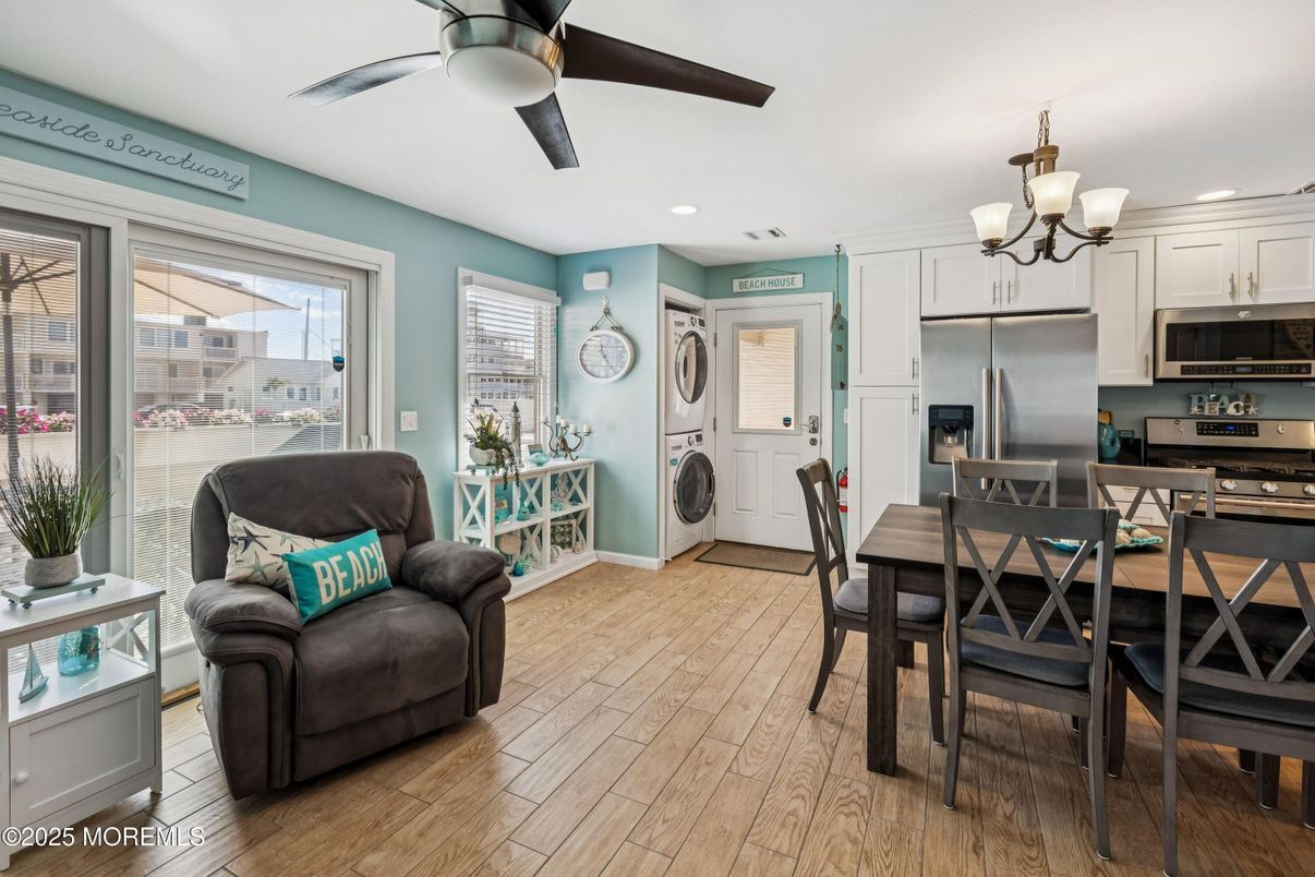 Chandelier, Dining room, Interior, Kitchen, Recessed Lighting, Stainless Steel Appliances, Wood Texture Flooring