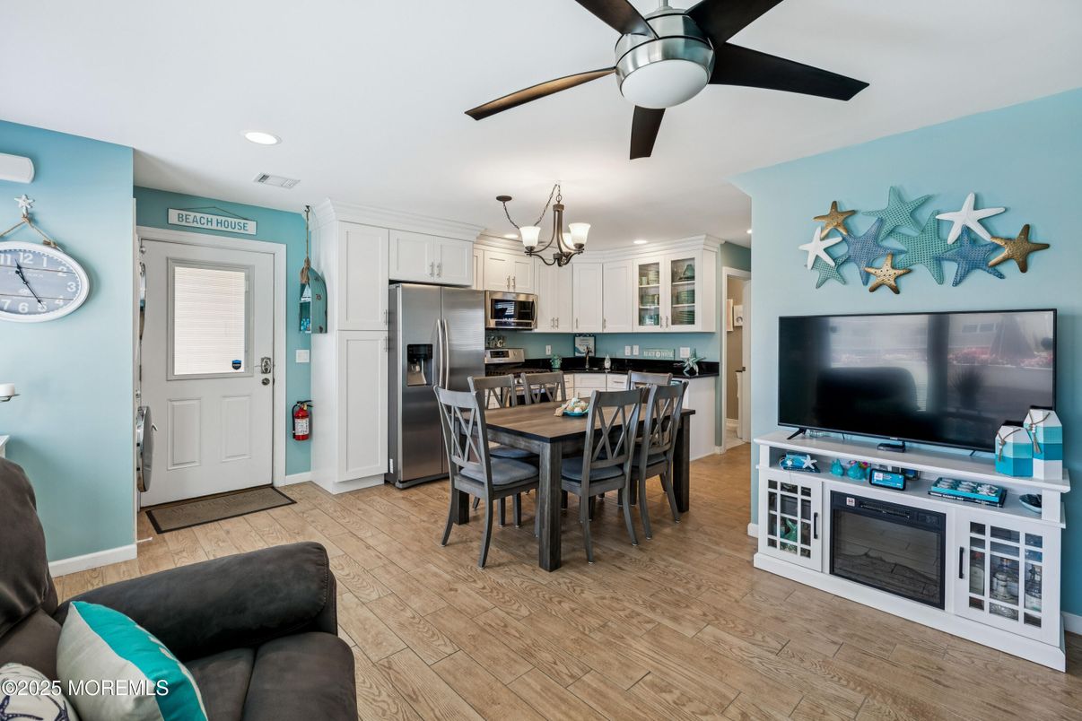 Chandelier, Dining room, Interior, Kitchen, Recessed Lighting, Stainless Steel Appliances, Wood Texture Flooring
