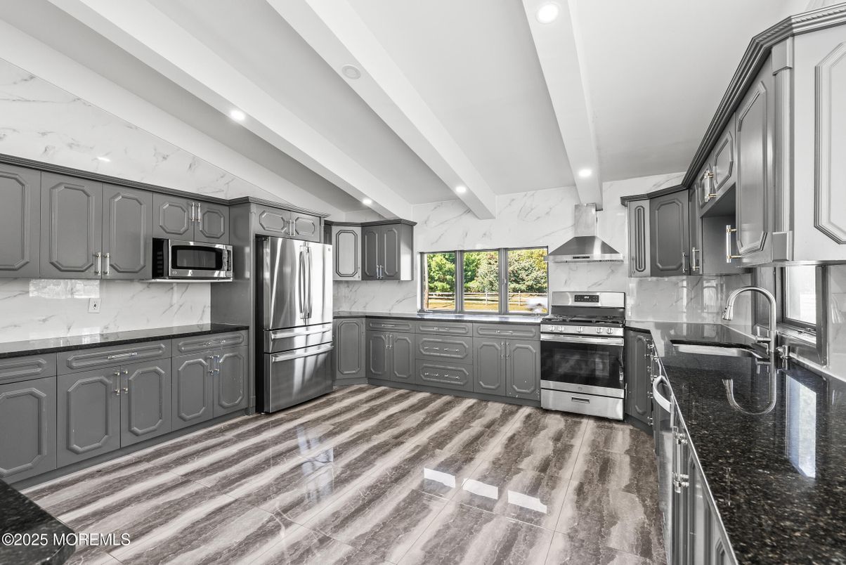 Interior, Kitchen, Marble Walls, Recessed Lighting, Stainless Steel Appliances