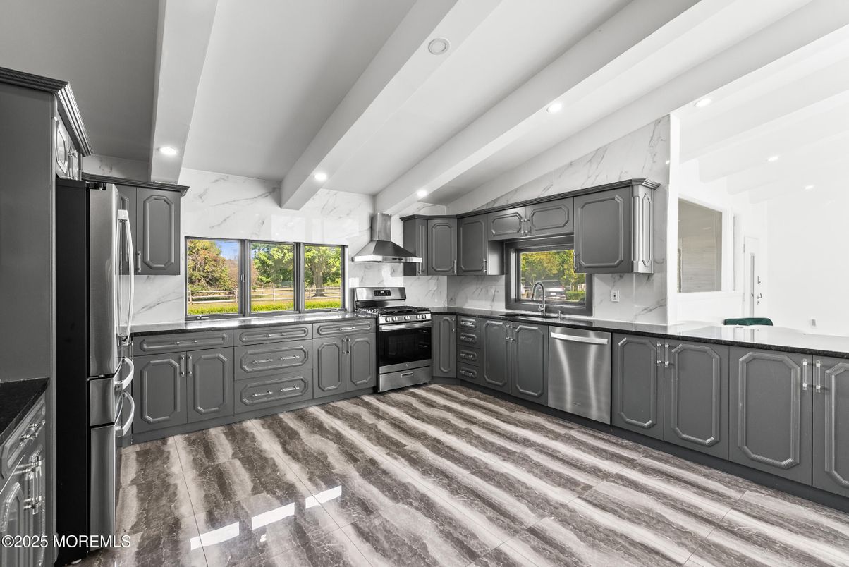 Interior, Kitchen, Marble Walls, Recessed Lighting, Stainless Steel Appliances