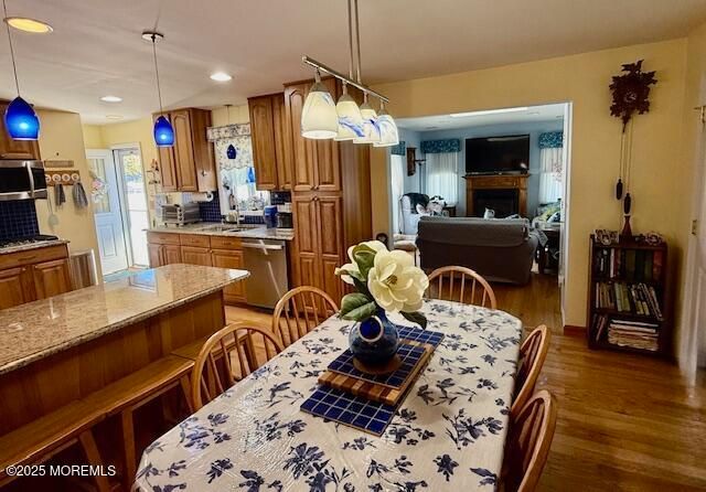 Dining room, Fireplace, Interior, Kitchen, Living room, Pendant Lights, Recessed Lighting, Wood Texture Flooring