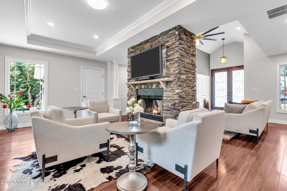 Fireplace, Interior, Living room, Pendant Lights, Recessed Lighting, Stone Walls, Wood Texture Flooring