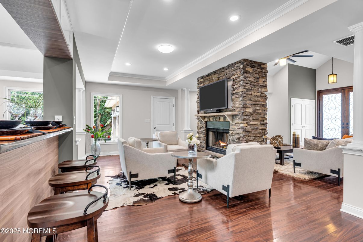 Fireplace, Interior, Living room, Pendant Lights, Recessed Lighting, Stone Walls, Wood Texture Flooring