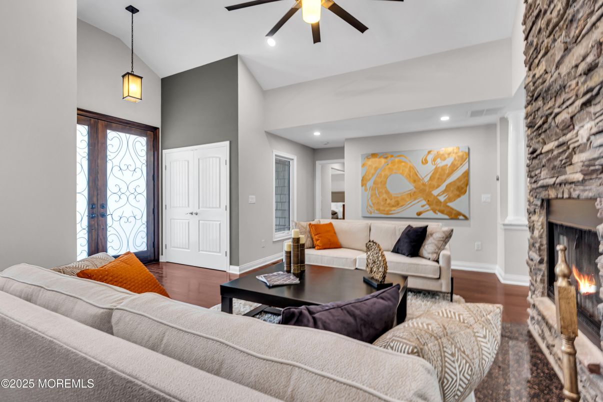 Fireplace, Interior, Living room, Pendant Lights, Recessed Lighting, Stone Walls, Wood Texture Flooring