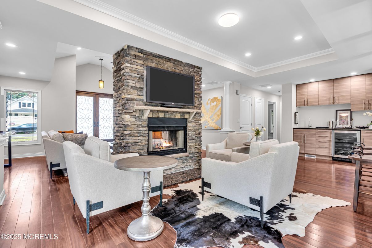 Fireplace, Interior, Living room, Pendant Lights, Recessed Lighting, Stone Walls, Wood Texture Flooring