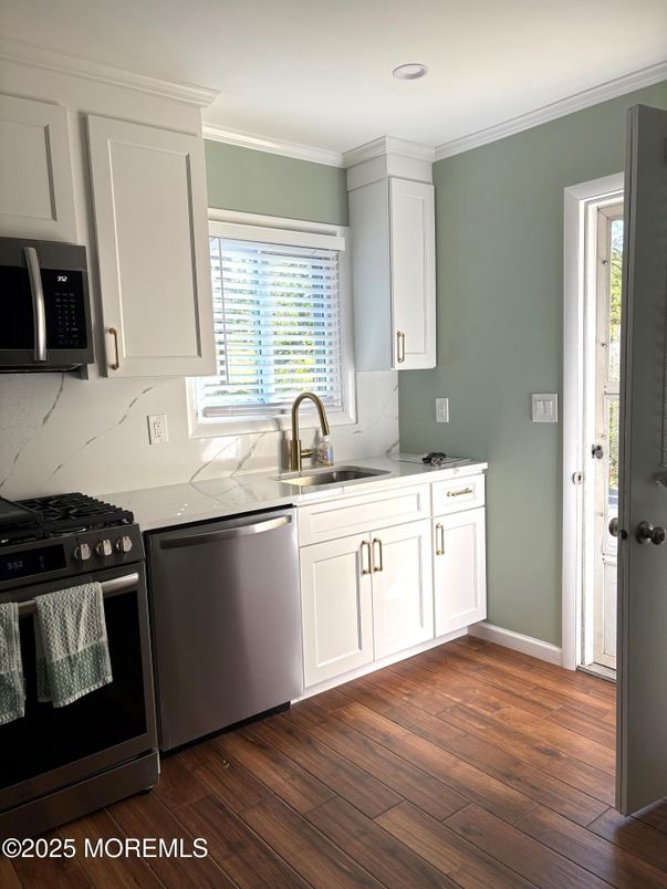 Interior, Kitchen, Marble Walls, Recessed Lighting, Stainless Steel Appliances, Wood Texture Flooring