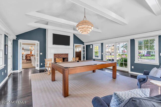 Billiard Table, Chandelier, Fireplace, Game Room, Interior, Living room, Pendant Lights, Wood Texture Flooring