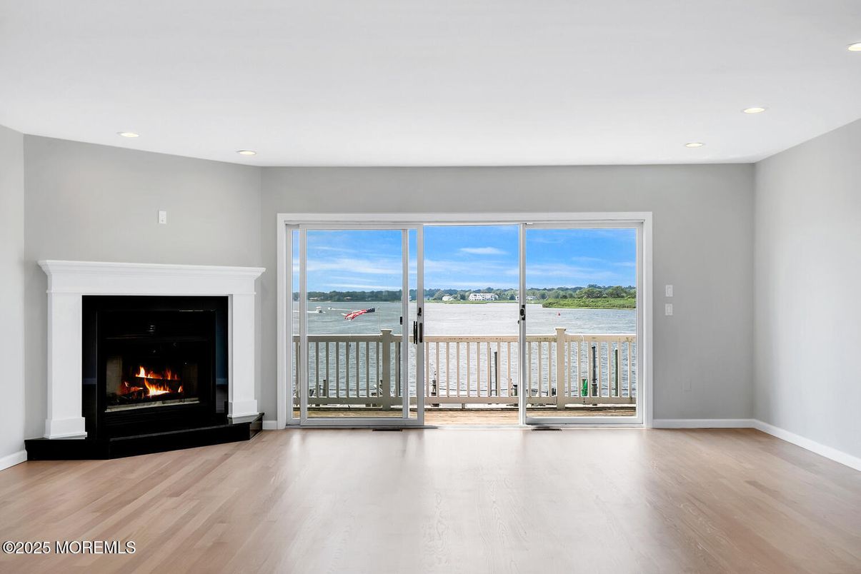 Empty room, Fireplace, Interior, Recessed Lighting, Water, Wood Texture Flooring