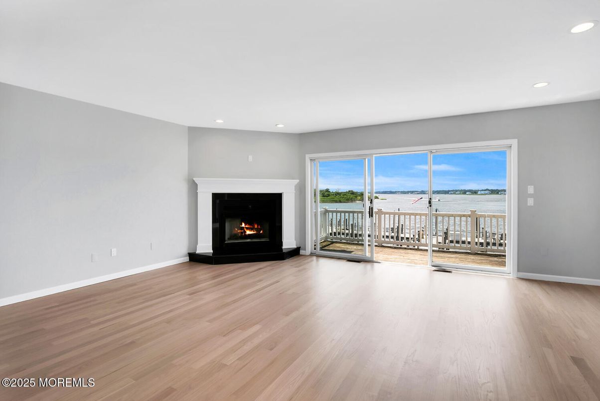 Empty room, Fireplace, Interior, Recessed Lighting, Water, Wood Texture Flooring