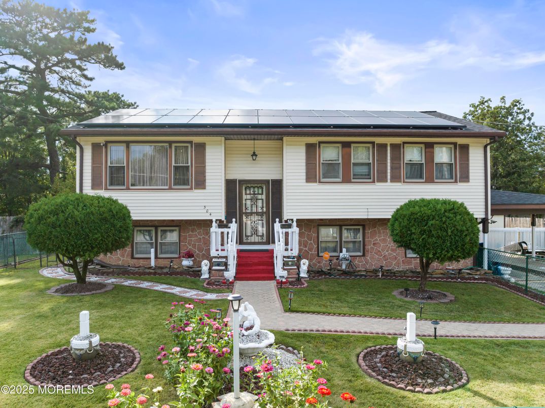Exterior, Facade, Solar Panels, Raised Ranch