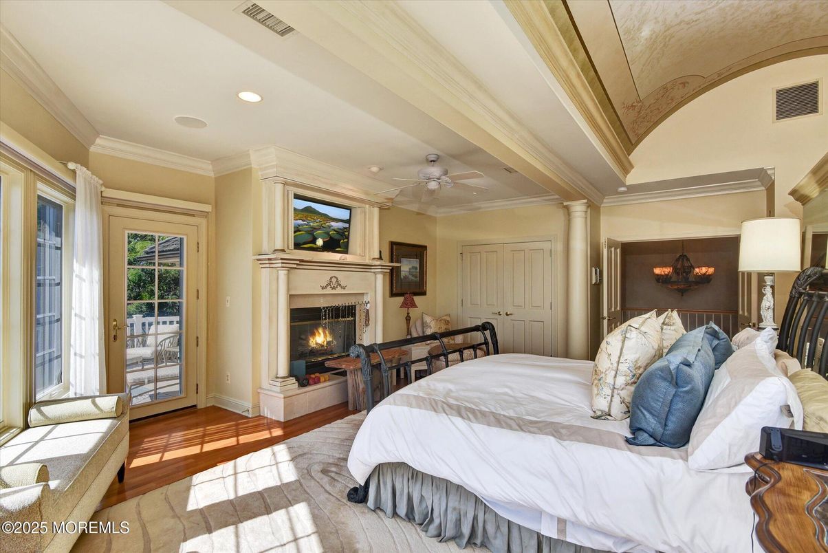 Bedroom, Chandelier, Fireplace, Interior, Recessed Lighting, Wood Texture Flooring