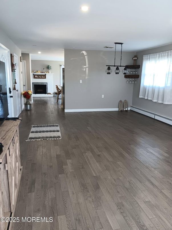 Empty room, Fireplace, Interior, Pendant Lights, Recessed Lighting, Wood Texture Flooring