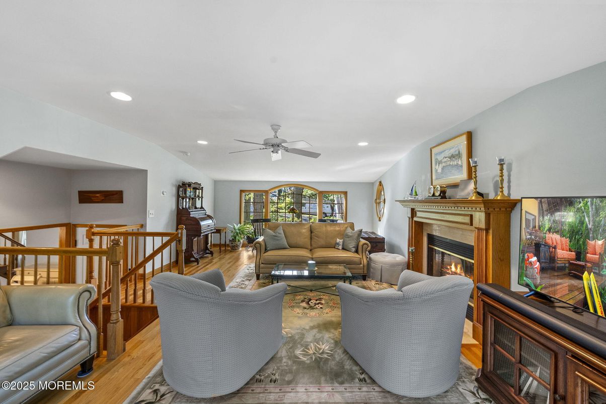 Fireplace, Interior, Living room, Piano, Recessed Lighting, Wood Texture Flooring