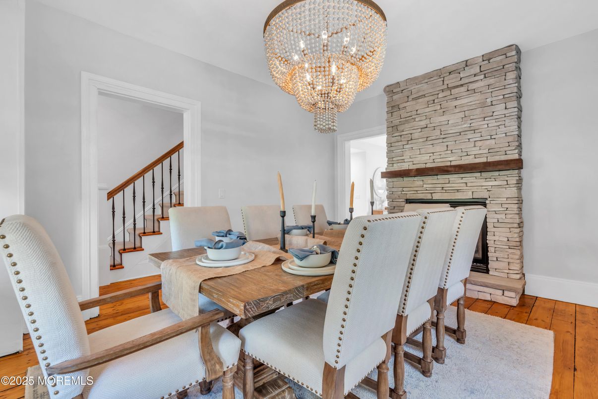 Chandelier, Dining room, Fireplace, Interior, Stone Walls, Wood Texture Flooring