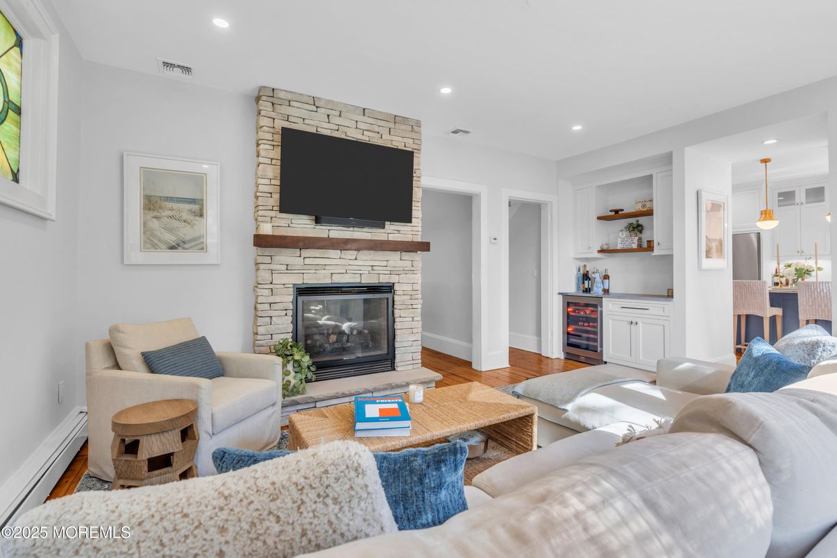 Fireplace, Interior, Living room, Pendant Lights, Recessed Lighting, Stone Walls, Wood Texture Flooring