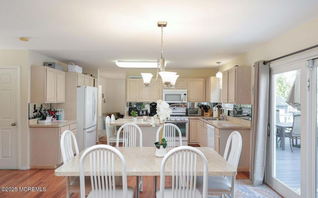 Dining room, Interior, Kitchen, Pendant Lights, Stainless Steel Appliances, Wood Texture Flooring