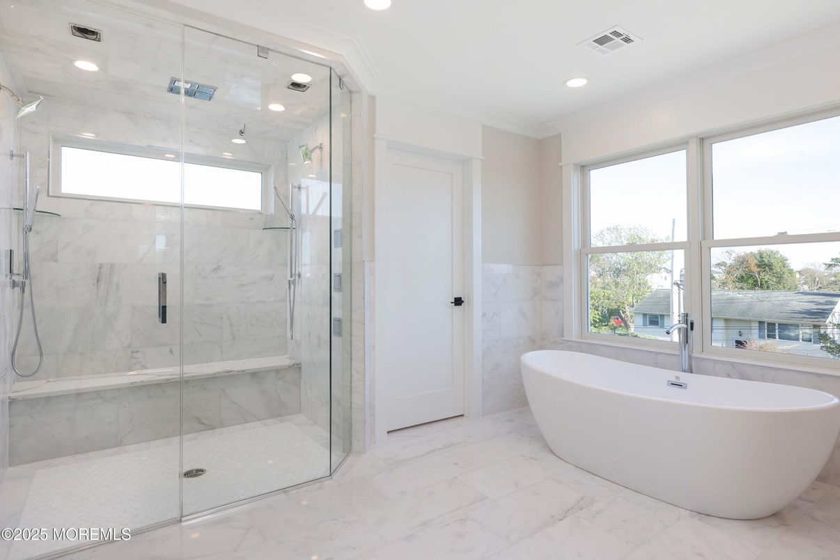 Bathroom, Free Standing Baths, Glass Shower, Interior, Marble, Marble Walls, Recessed Lighting, Water