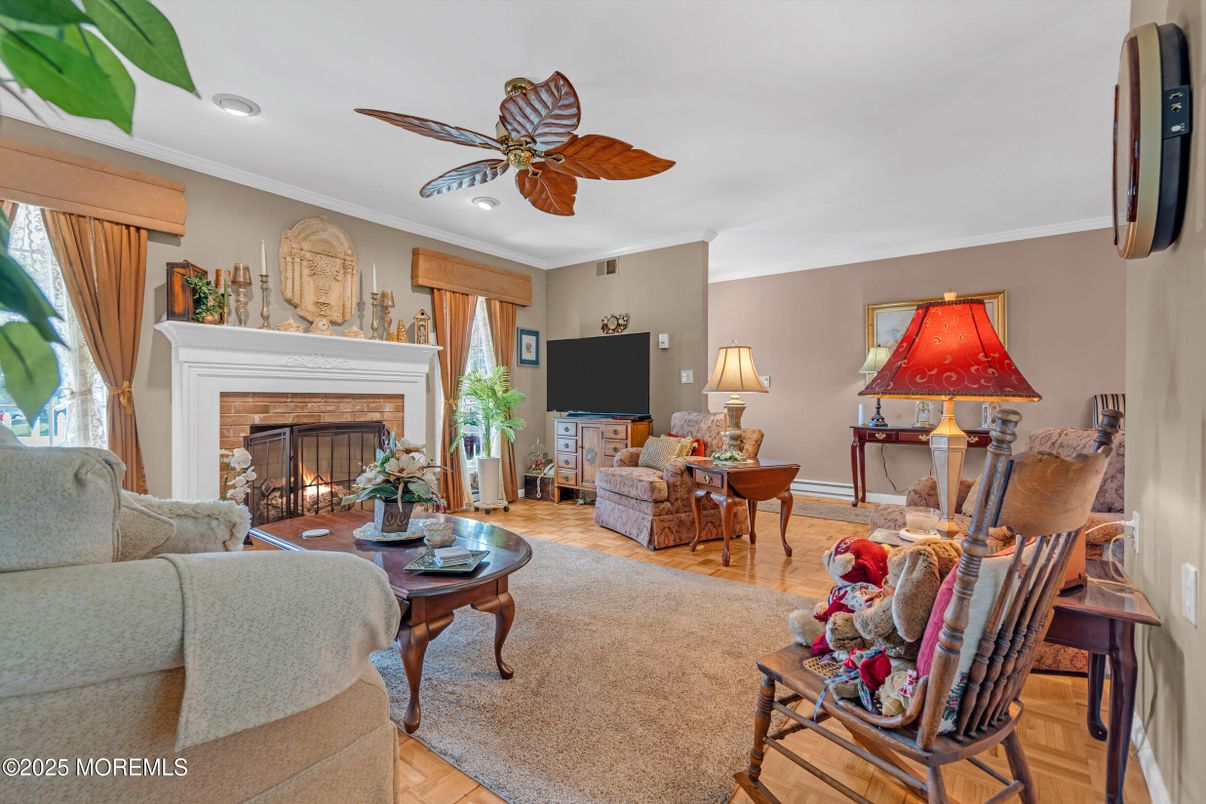 Dining room, Fireplace, Interior, Living room, Recessed Lighting, Wood Texture Flooring