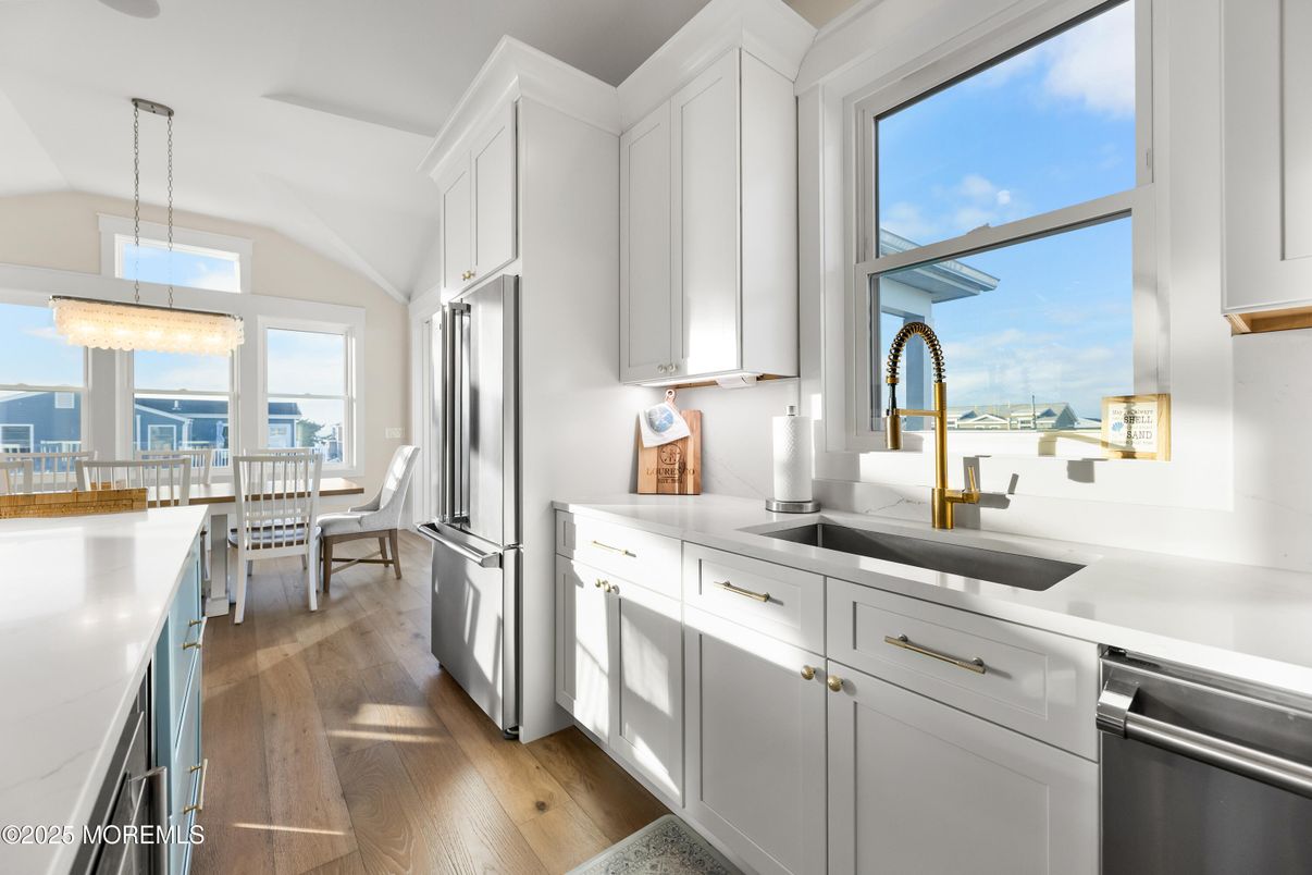 Dining room, Interior, Kitchen, Pendant Lights, Stainless Steel Appliances, Water, Wood Texture Flooring