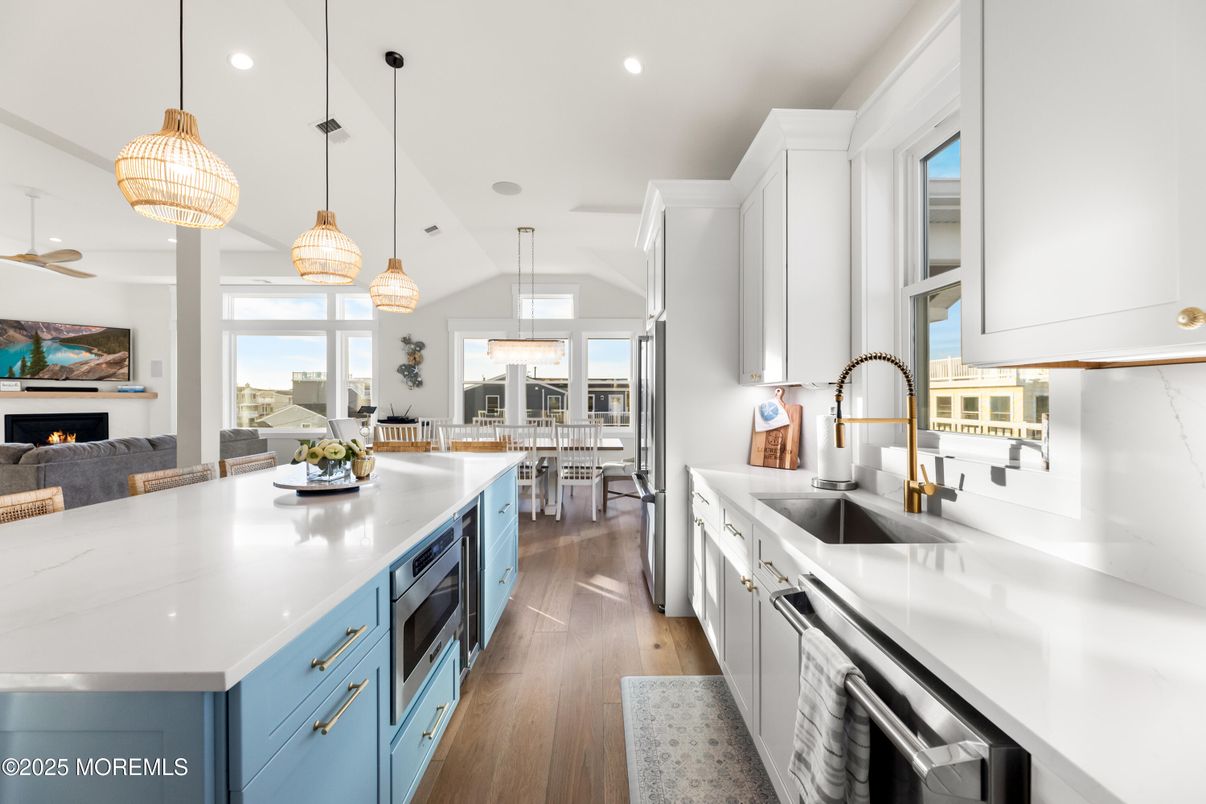 Dining room, Fireplace, Interior, Kitchen, Pendant Lights, Recessed Lighting, Stainless Steel Appliances, Wood Texture Flooring