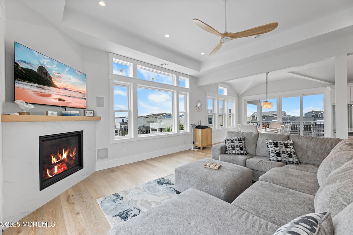 Dining room, Fireplace, Interior, Living room, Pendant Lights, Recessed Lighting, Wood Texture Flooring