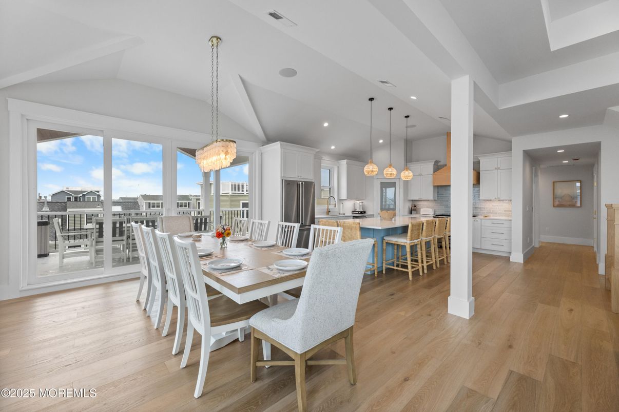 Chandelier, Dining room, Interior, Kitchen, Pendant Lights, Recessed Lighting, Stainless Steel Appliances, Wood Texture Flooring