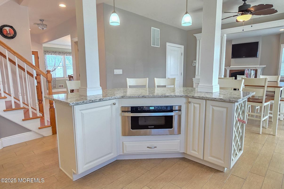 Dining room, Interior, Kitchen, Pendant Lights, Recessed Lighting, Stainless Steel Appliances, Wood Texture Flooring