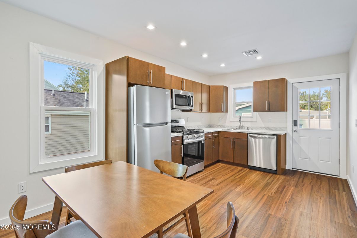 Dining room, Interior, Kitchen, Recessed Lighting, Stainless Steel Appliances, Wood Texture Flooring