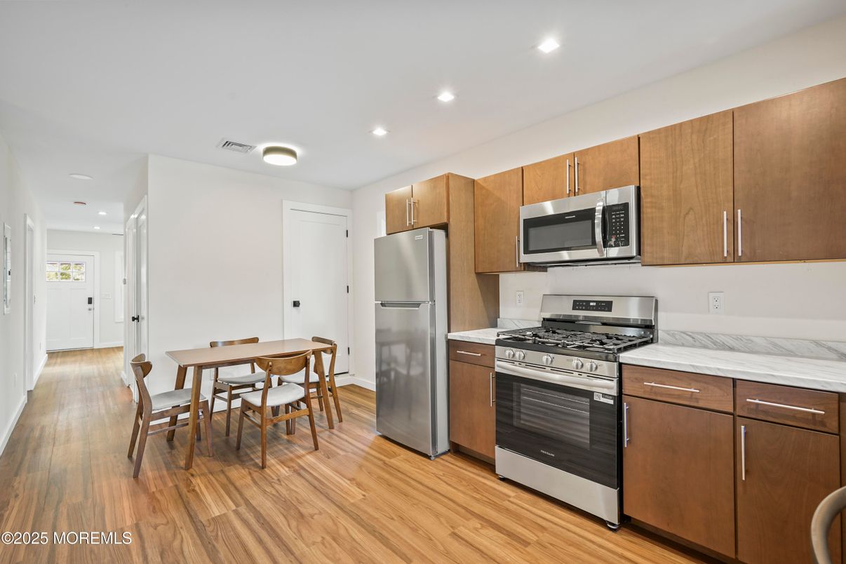 Dining room, Interior, Kitchen, Recessed Lighting, Stainless Steel Appliances, Wood Texture Flooring