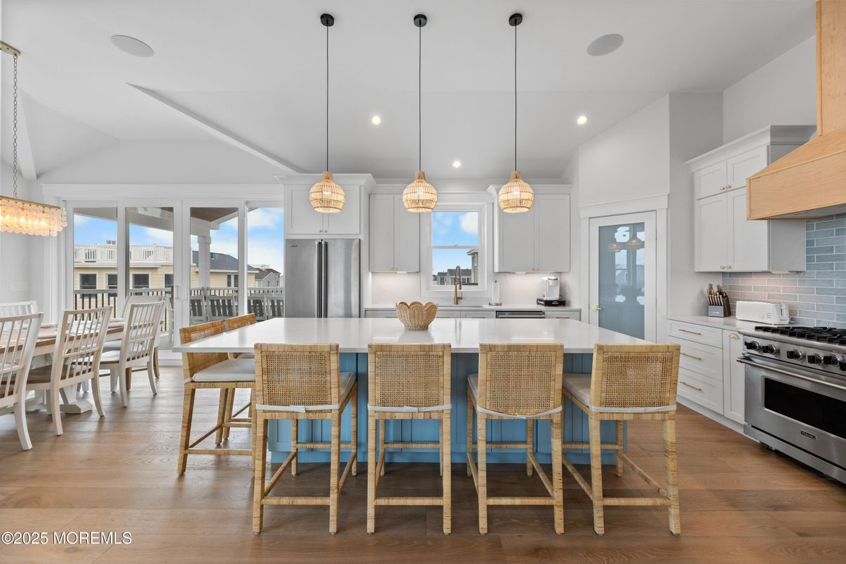 Dining room, Interior, Kitchen, Pendant Lights, Recessed Lighting, Stainless Steel Appliances, Wood Texture Flooring