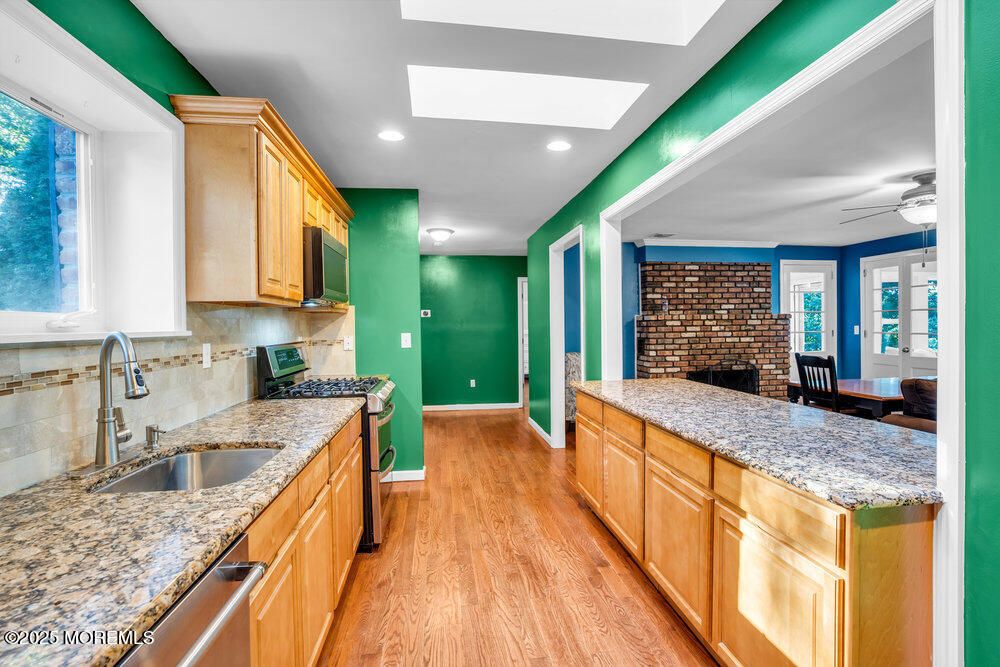 Fireplace, Interior, Kitchen, Recessed Lighting, Stone Walls, Wood Texture Flooring