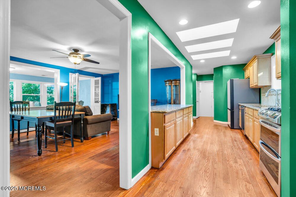Dining room, Interior, Kitchen, Living room, Recessed Lighting, Stainless Steel Appliances, Wood Texture Flooring
