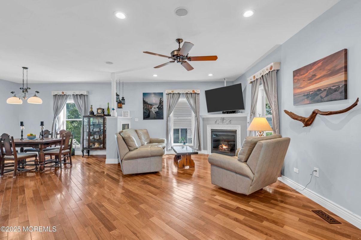 Dining room, Fireplace, Interior, Living room, Pendant Lights, Recessed Lighting, Wood Texture Flooring