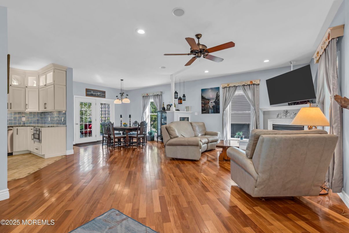 Dining room, Fireplace, Interior, Living room, Pendant Lights, Recessed Lighting, Wood Texture Flooring