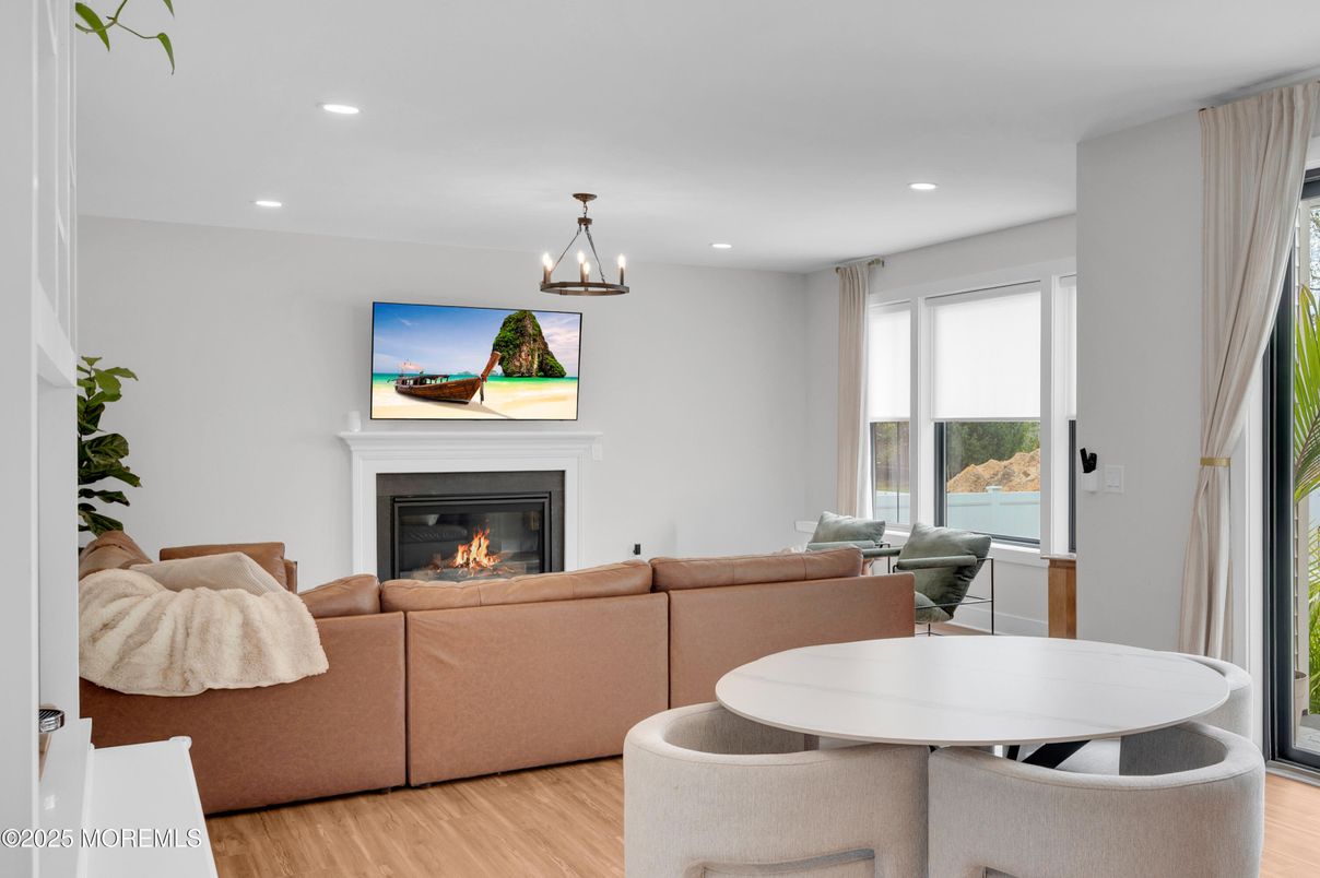 Dining room, Fireplace, Interior, Living room, Pendant Lights, Recessed Lighting, Wood Texture Flooring