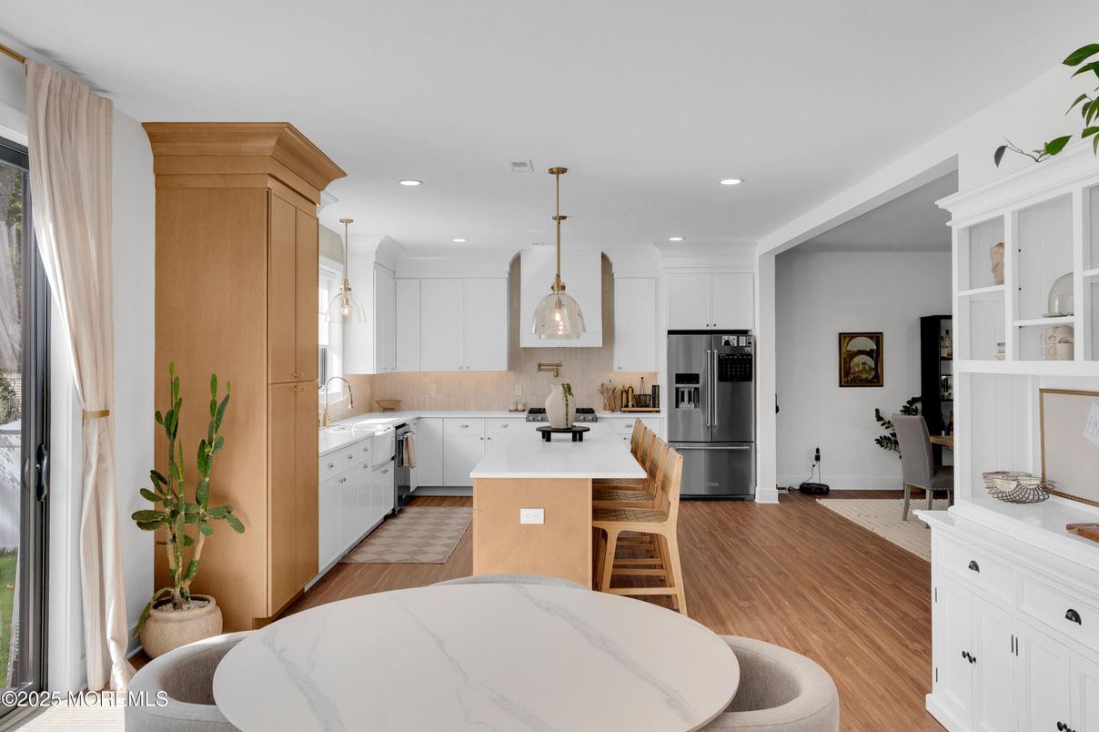 Dining room, Interior, Kitchen, Pendant Lights, Recessed Lighting, Stainless Steel Appliances, Wood Texture Flooring