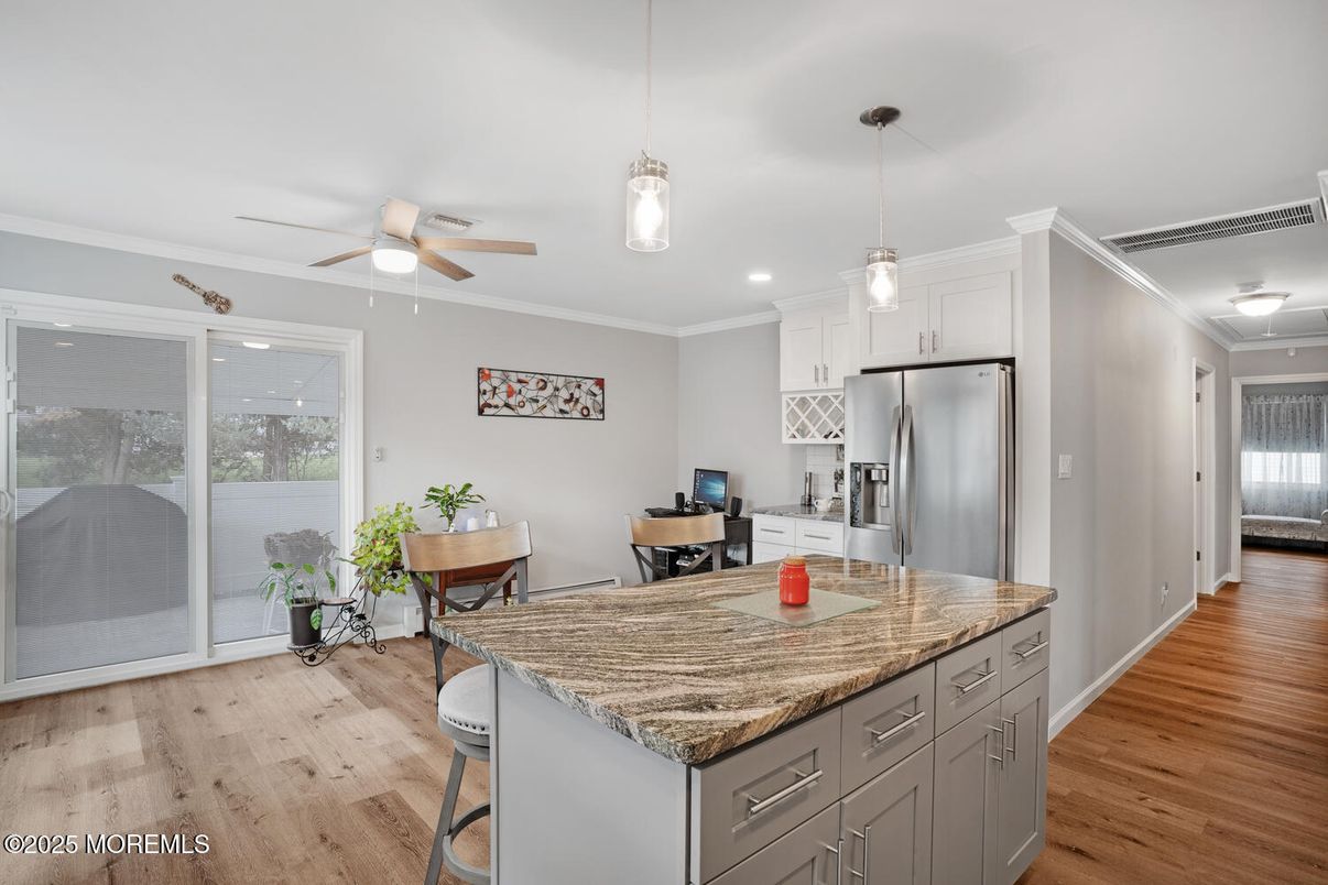 Dining room, Interior, Kitchen, Pendant Lights, Recessed Lighting, Stainless Steel Appliances, Wood Texture Flooring