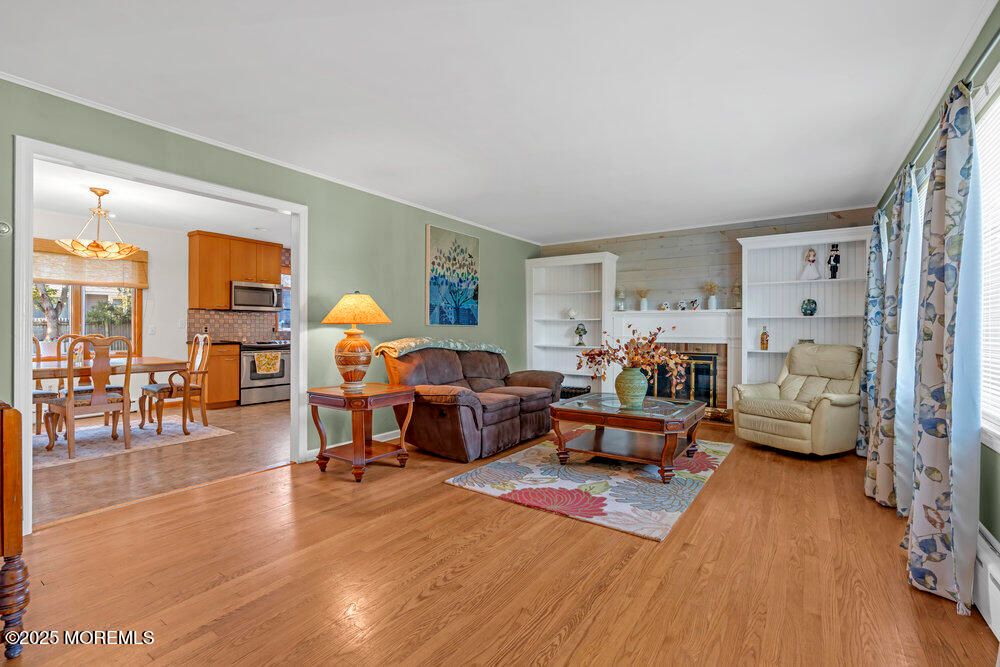 Chandelier, Dining room, Fireplace, Interior, Living room, Wood Texture Flooring