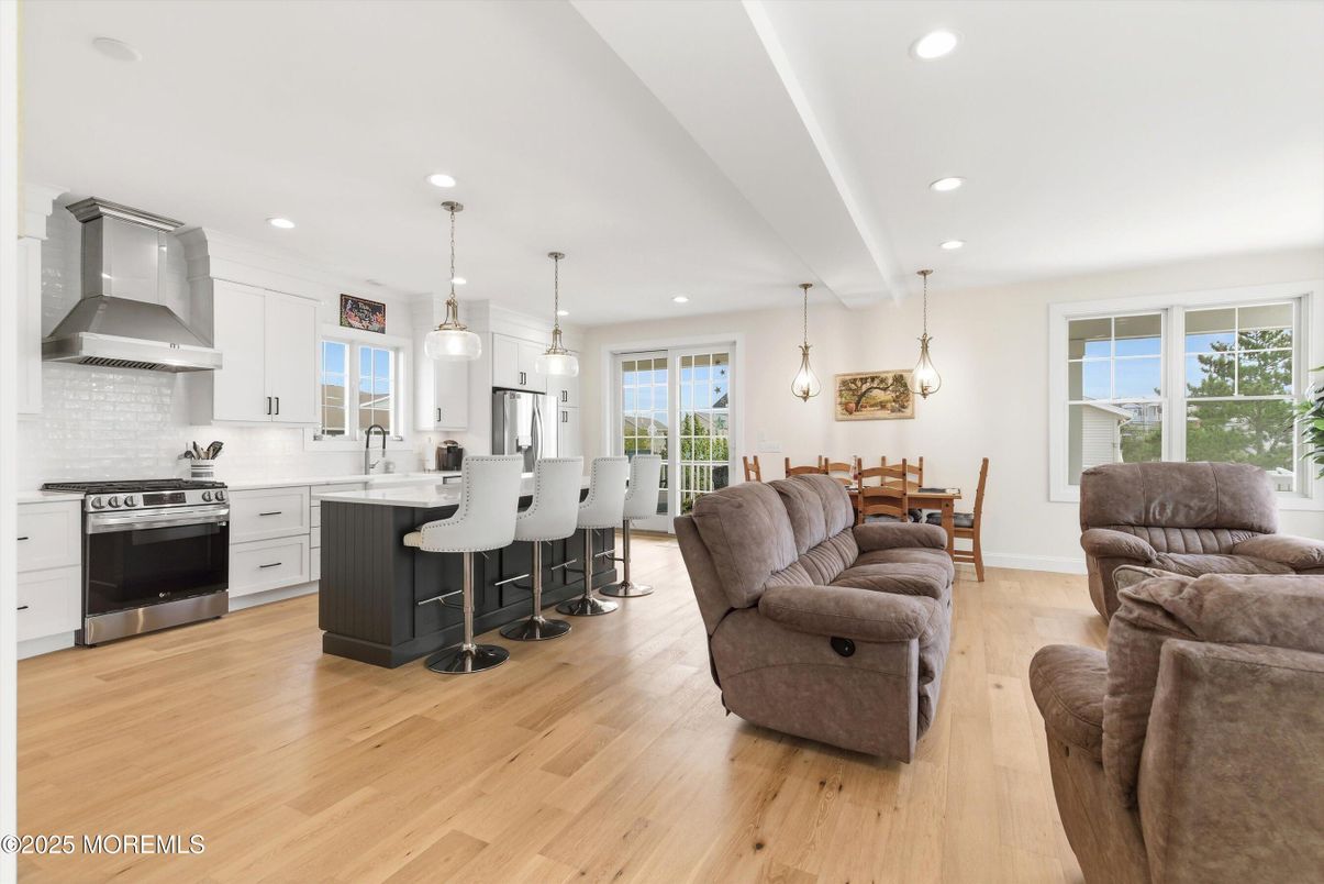 Dining room, Interior, Kitchen, Living room, Pendant Lights, Recessed Lighting, Stainless Steel Appliances, Wood Texture Flooring