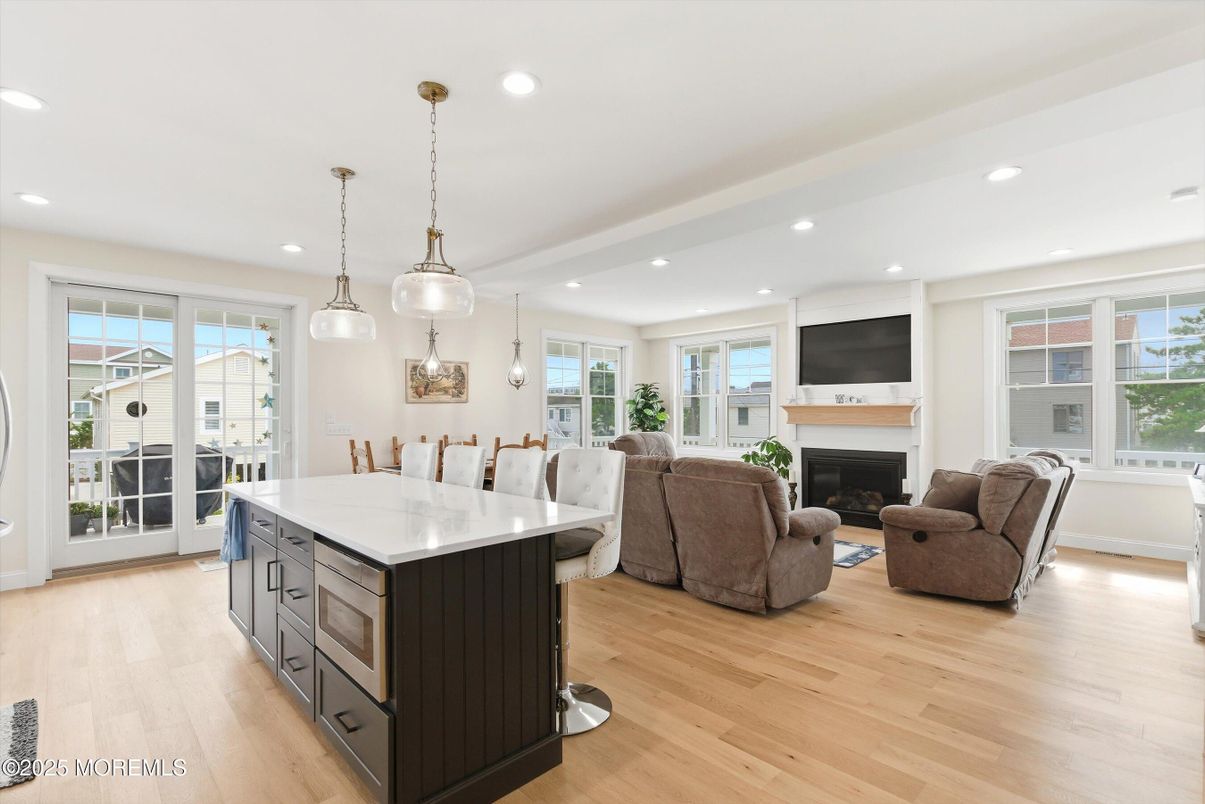 Dining room, Fireplace, Interior, Kitchen, Living room, Pendant Lights, Recessed Lighting, Wood Texture Flooring